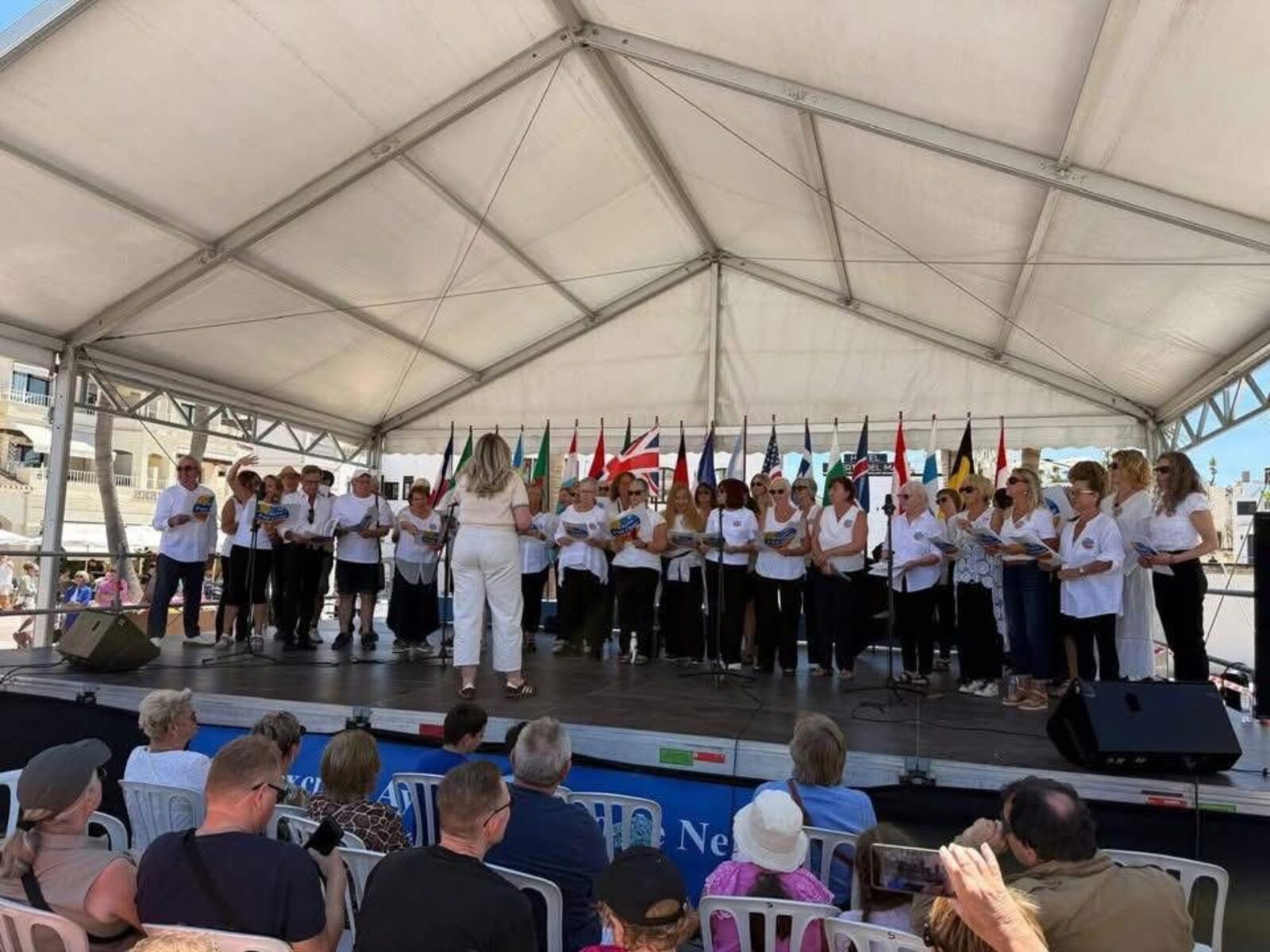 Costa Pop Choir performing on stage in Nerja